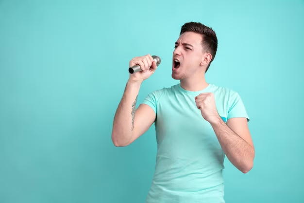 Young guy sings a song into a microphone