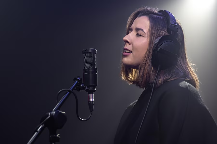 Girl singing with a headset microphone