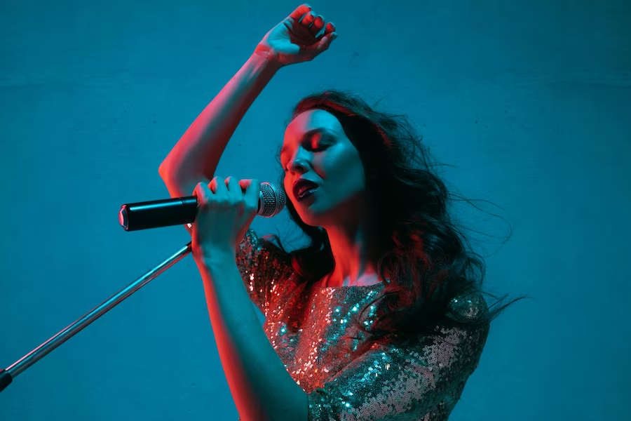 Woman singing with hand gestures