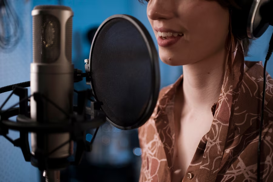 Woman singing in front of a microphone