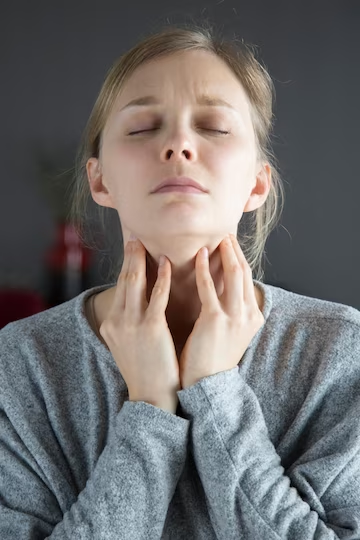 Woman holding her neck