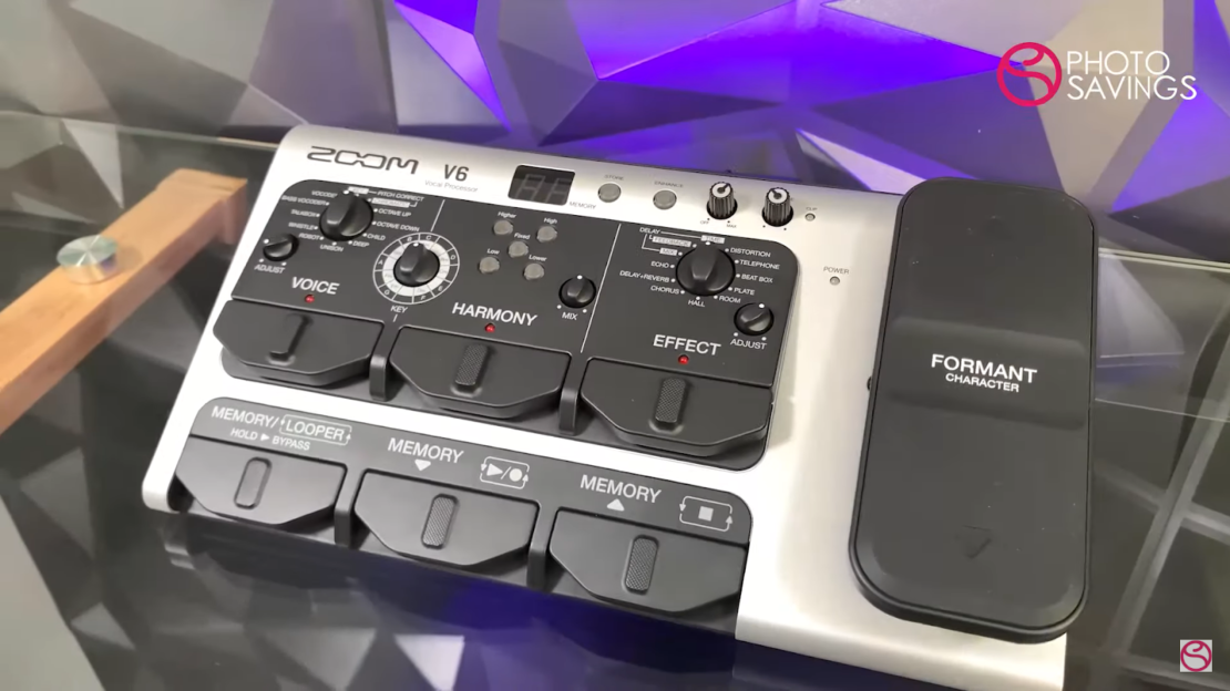 Zoom v6 vocal processor on transparent glass table