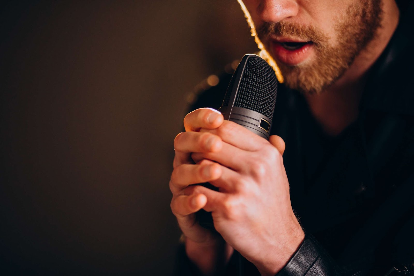 A man singing into a microphone